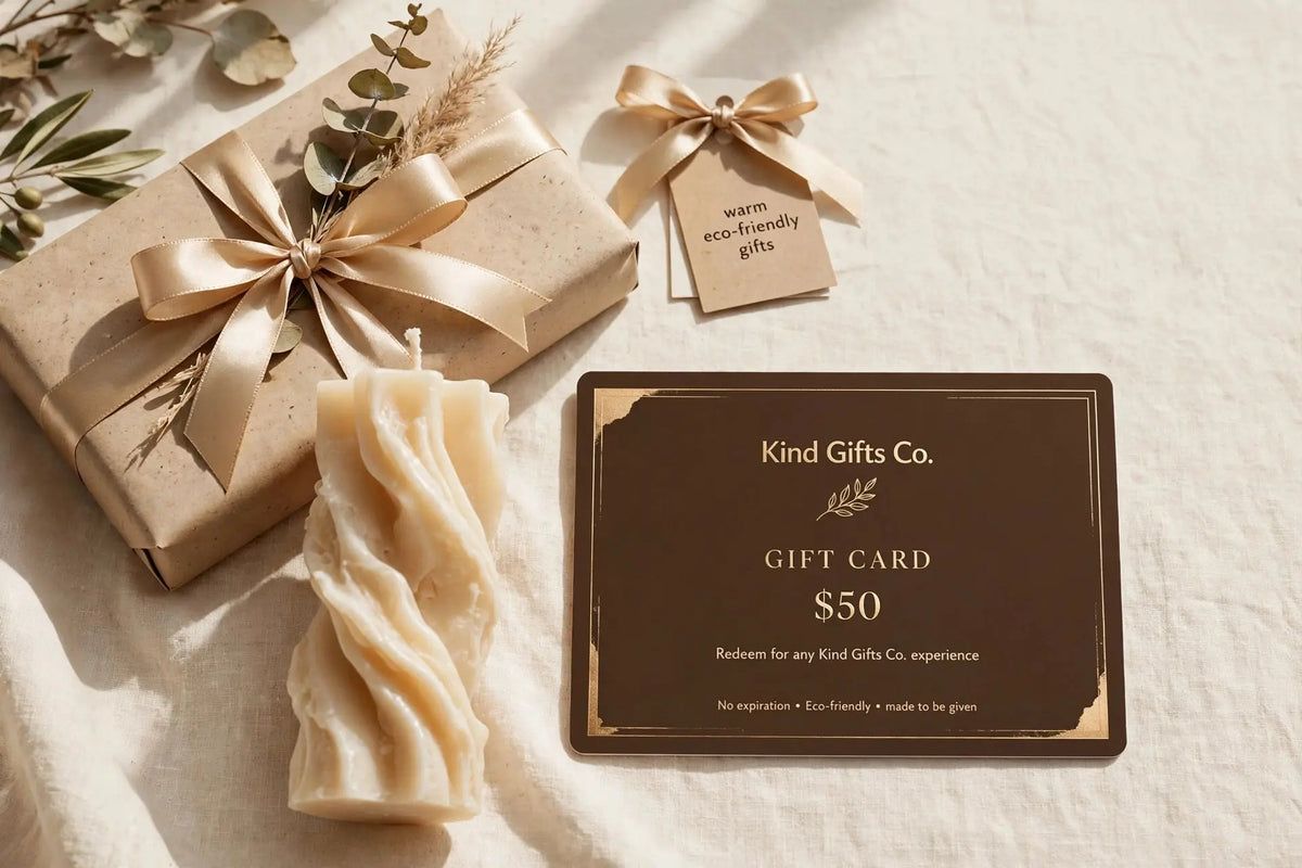 Kind Gifts Co. Gift Card with a sculptural candle and wrapped gift box